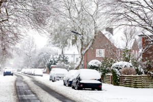 Cars parked on a snowy street